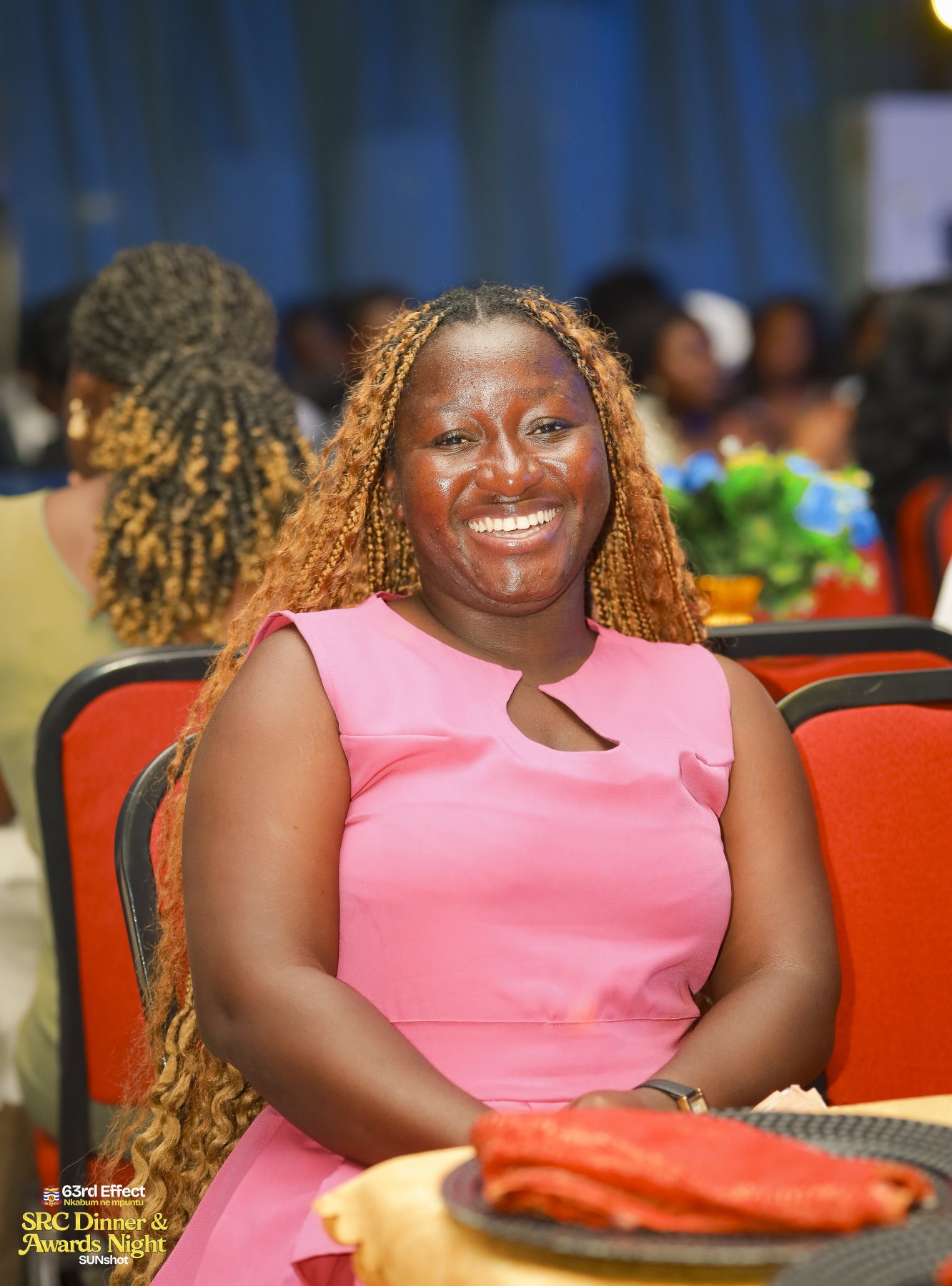 Attendee smiling in the event hall