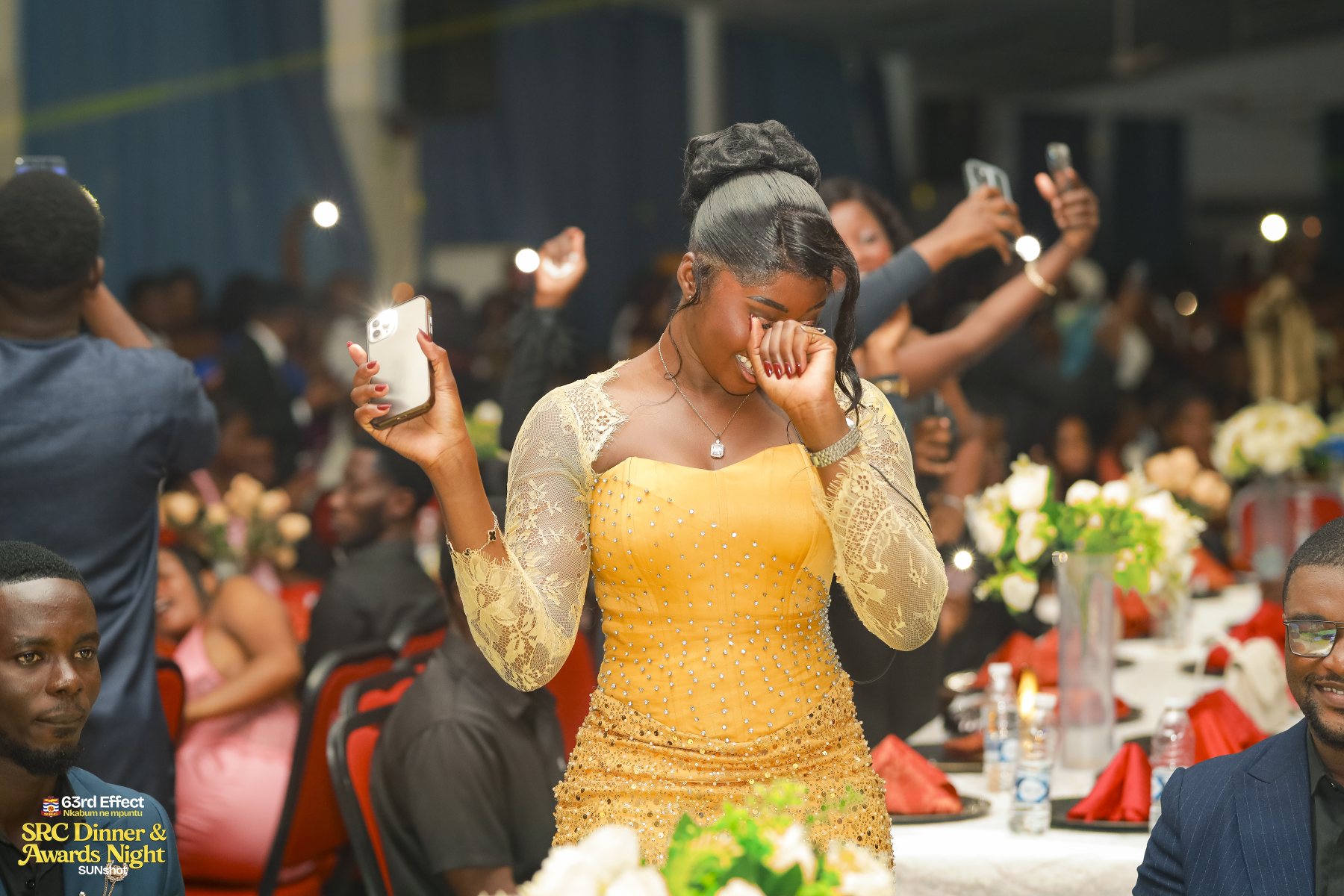 Audience members celebrating a stage moment