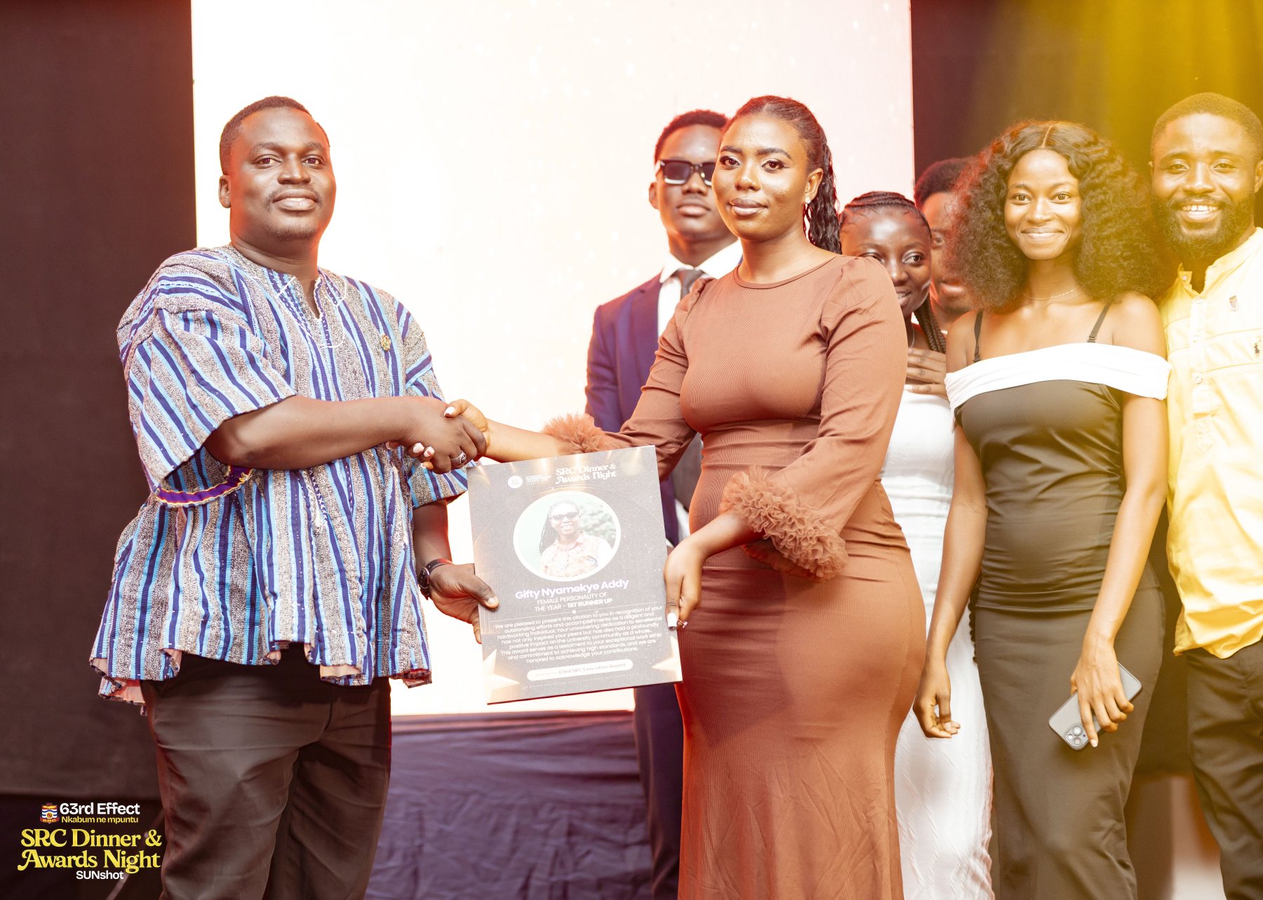 Award presentation with event organizers