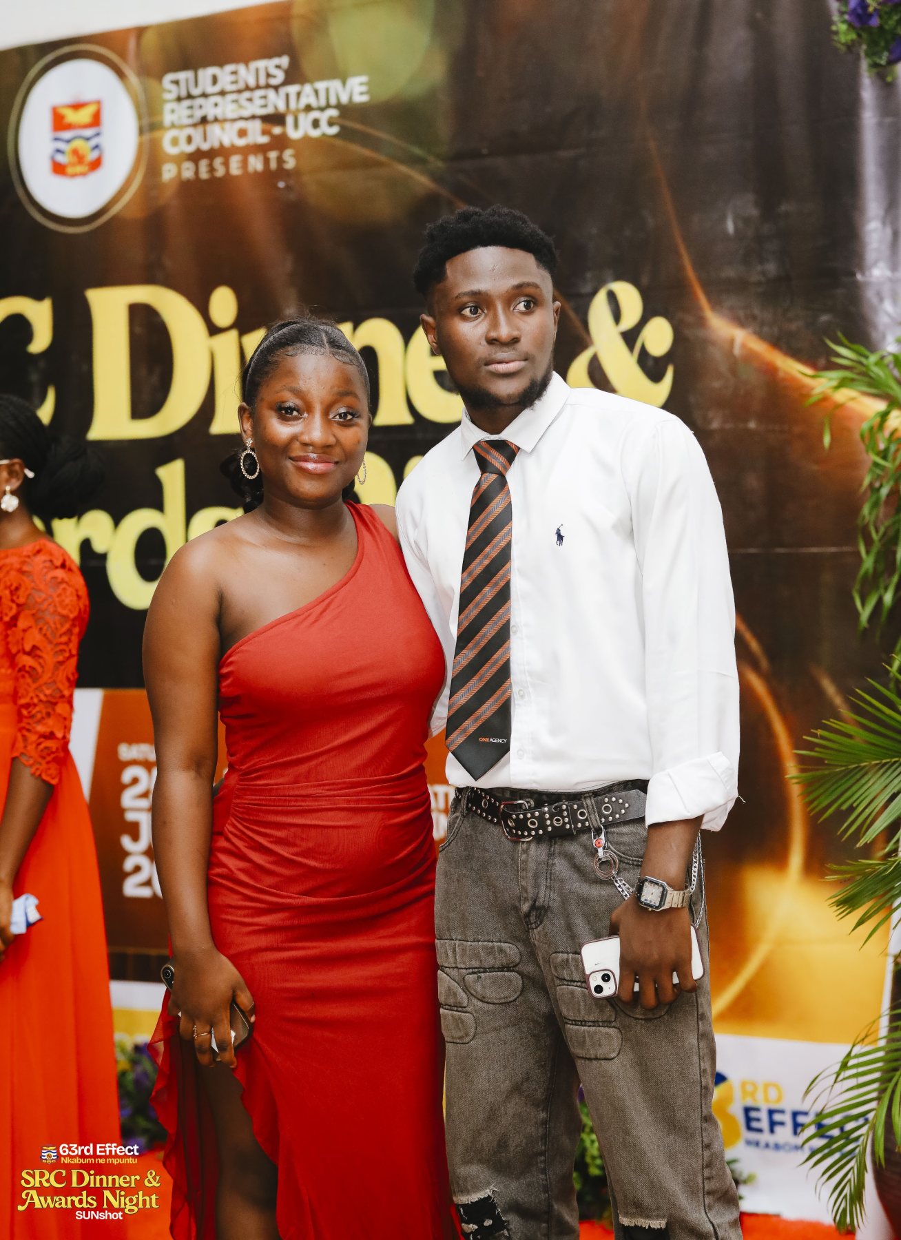 Attendees in front of the awards-night branding
